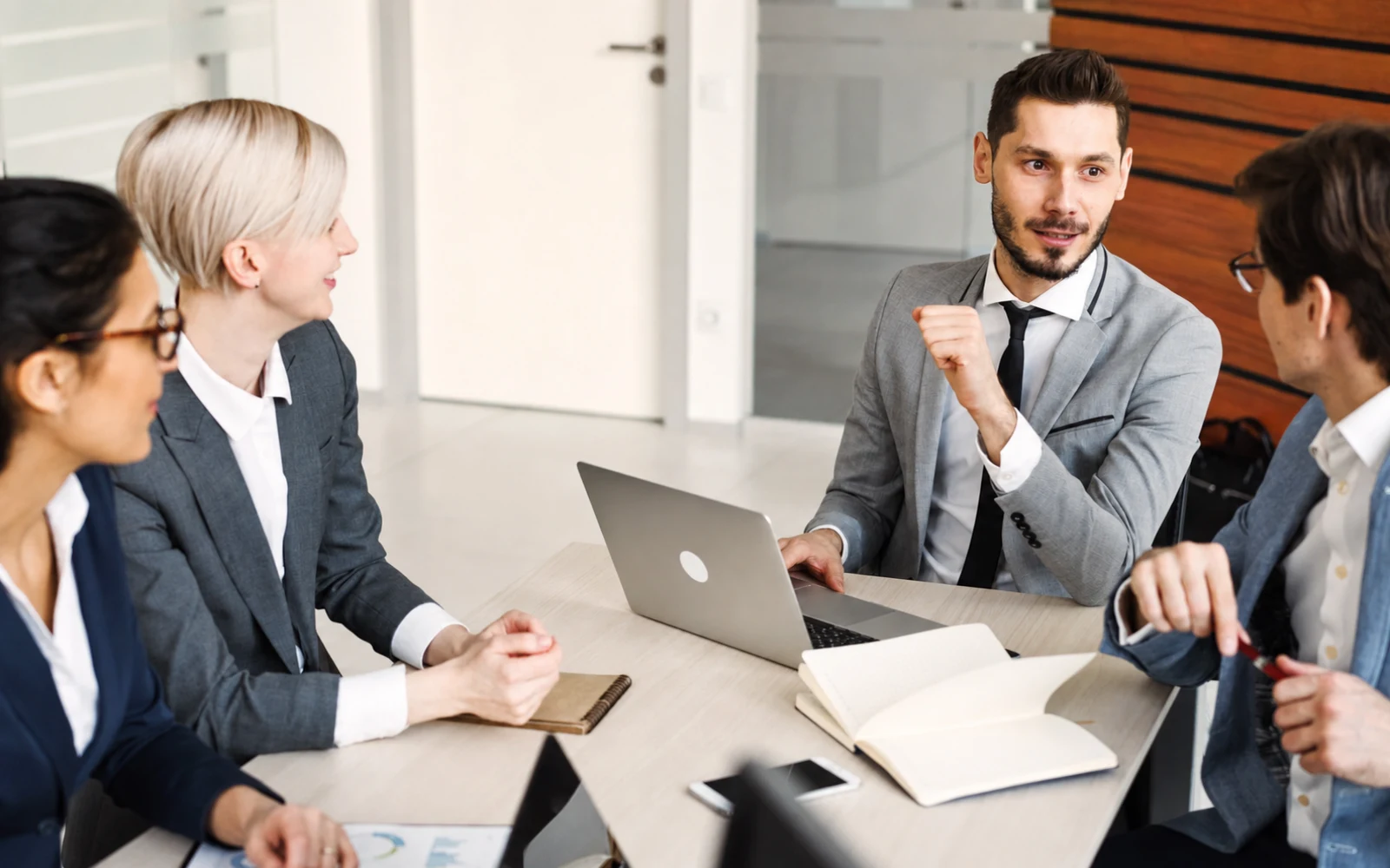 Accounting firm team meeting to review engagements and business performance