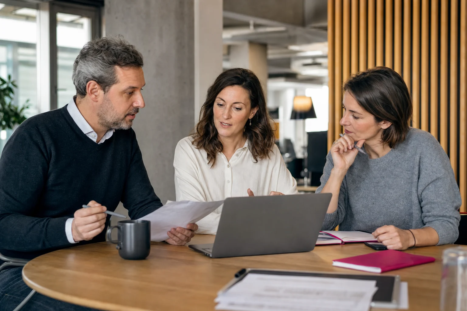Engagement and billing leads reviewing items ready to invoice around a computer